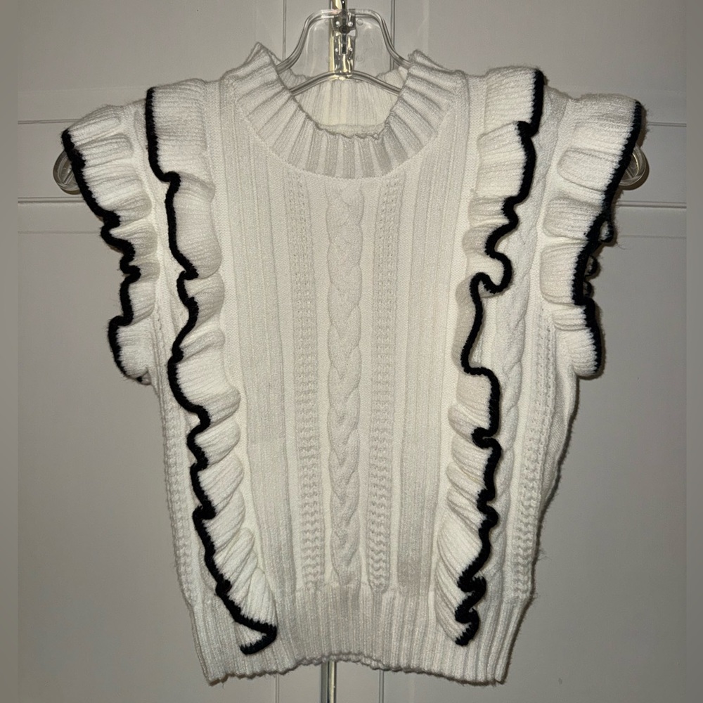 Chic White Ruffled Sweater with Black Trim